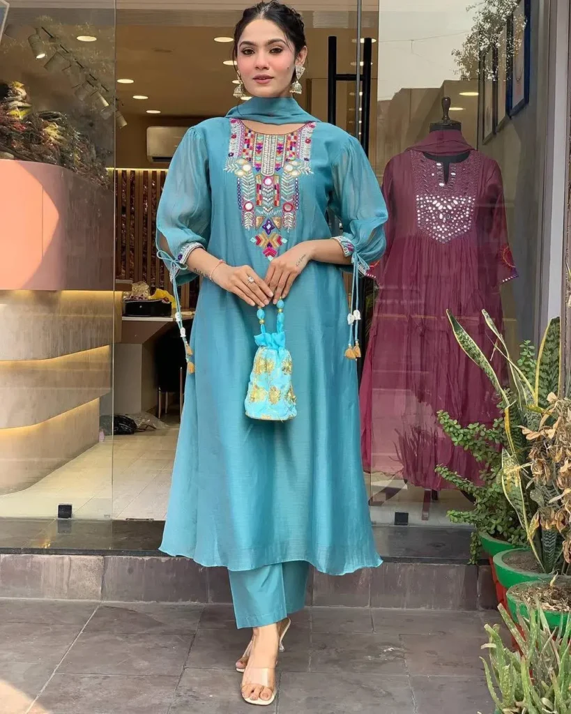 Woman in sky blue embroidered kurta set with dupatta and ethnic accessories