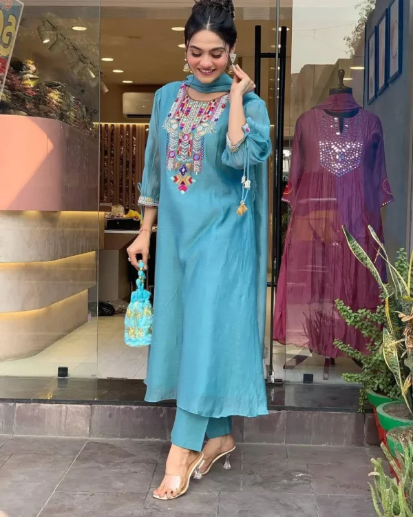 Woman in sky blue embroidered kurta set with dupatta and ethnic accessories