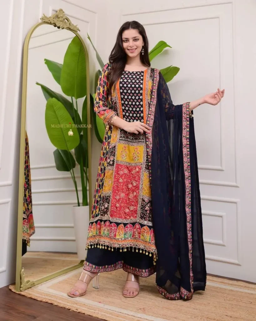 Woman wearing an elegant green embroidered kurta with plazzo set and dupatta – perfect ethnic wear for festive occasions