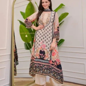 Woman wearing yellow-red printed kurta with mirror work and navy plazzo – festive Indian ethnic outfit