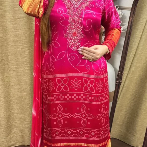 Ethnic pink suit with orange dupatta border and festive look