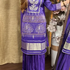 Purple embroidered kurti set with silver floral motifs, paired with sharara and dupatta – festive ethnic wear for women.