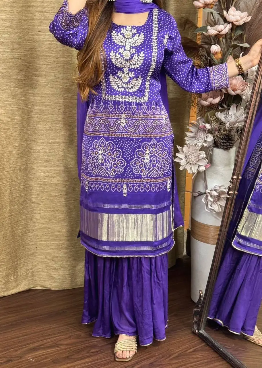 Purple embroidered kurti set with silver floral motifs, paired with sharara and dupatta – festive ethnic wear for women.